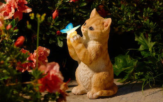 Small Figurines Light up the Garden for a Charming Moment